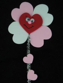 flower magnet made from craft foam hearts and pipeceaners